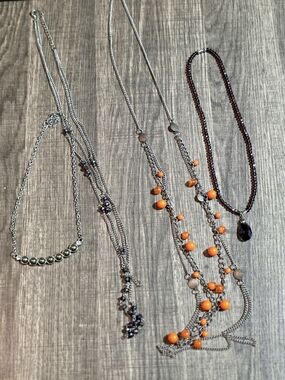 4 Pack Of Costume Jewelry. 2 Long, 1 Purple And 1 Silver, Green And White